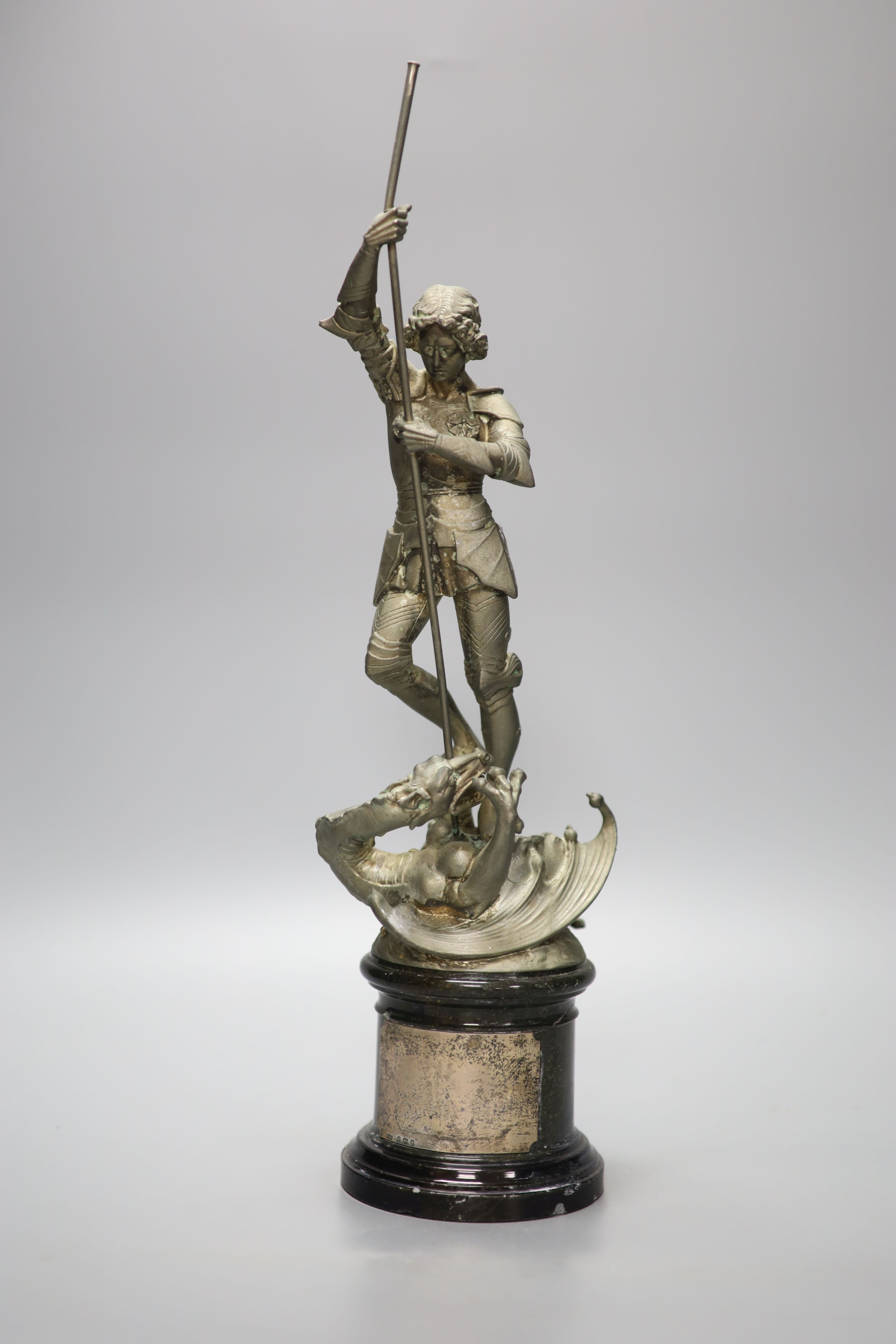 A spelter figure of St George and the Dragon, on turned marble base with vacant silver cartouche, height 41cm